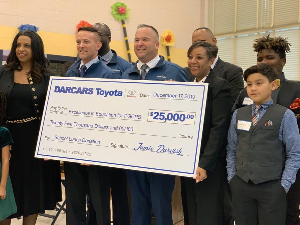 Darcars presents check for Excellence In Education