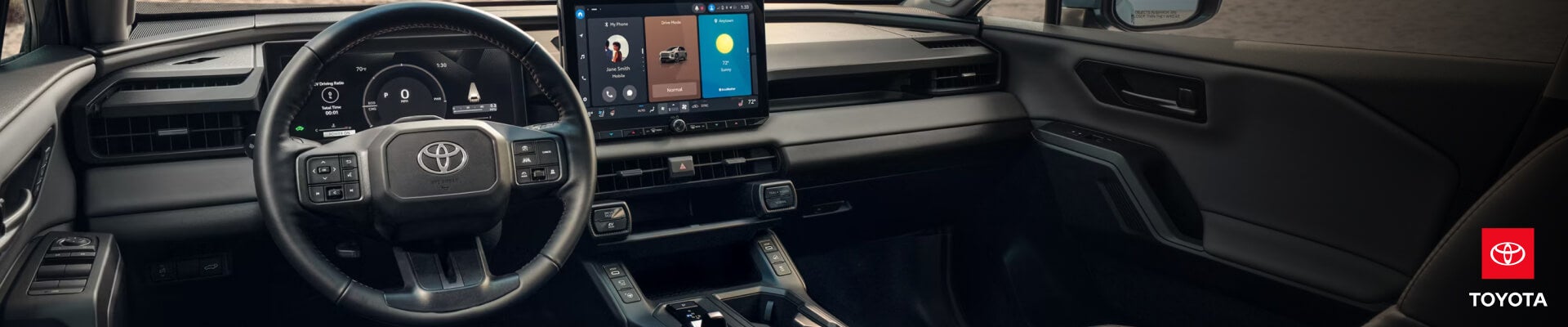 Interior view showcasing a Toyota RAV4 dashboard and digital touchscreen with a sunny beach setting in the background.