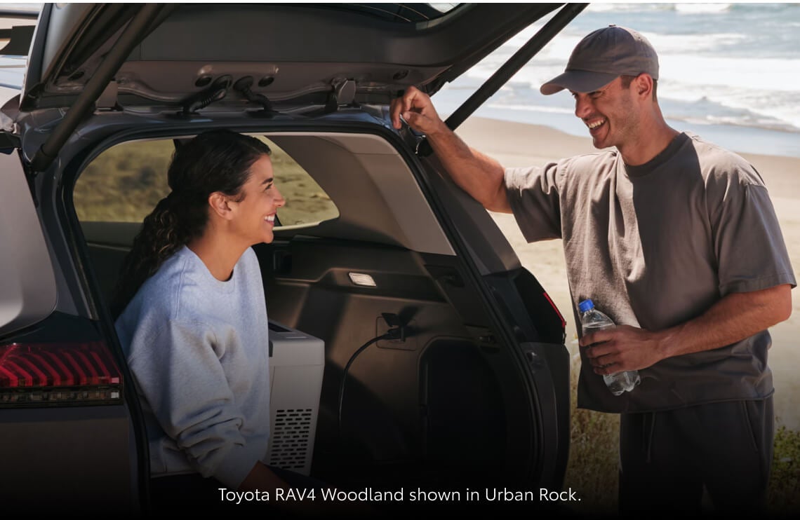 Close-up view looking into the rear cargo area of a 2026 Toyota RAV4 Woodland Edition in Urban Rock.